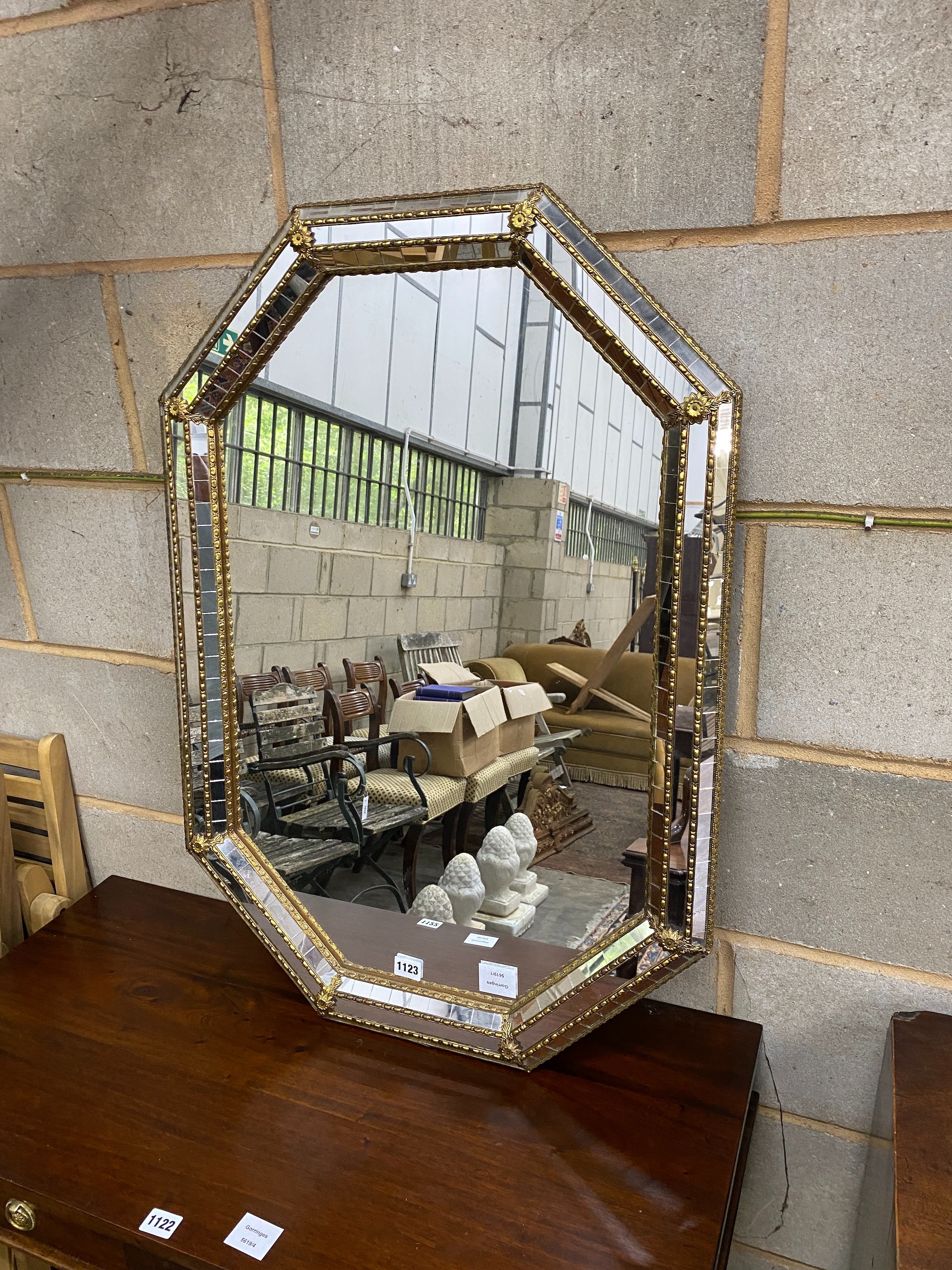 A Venetian style parcel gilt wall mirror, width 58cm, height 85cm